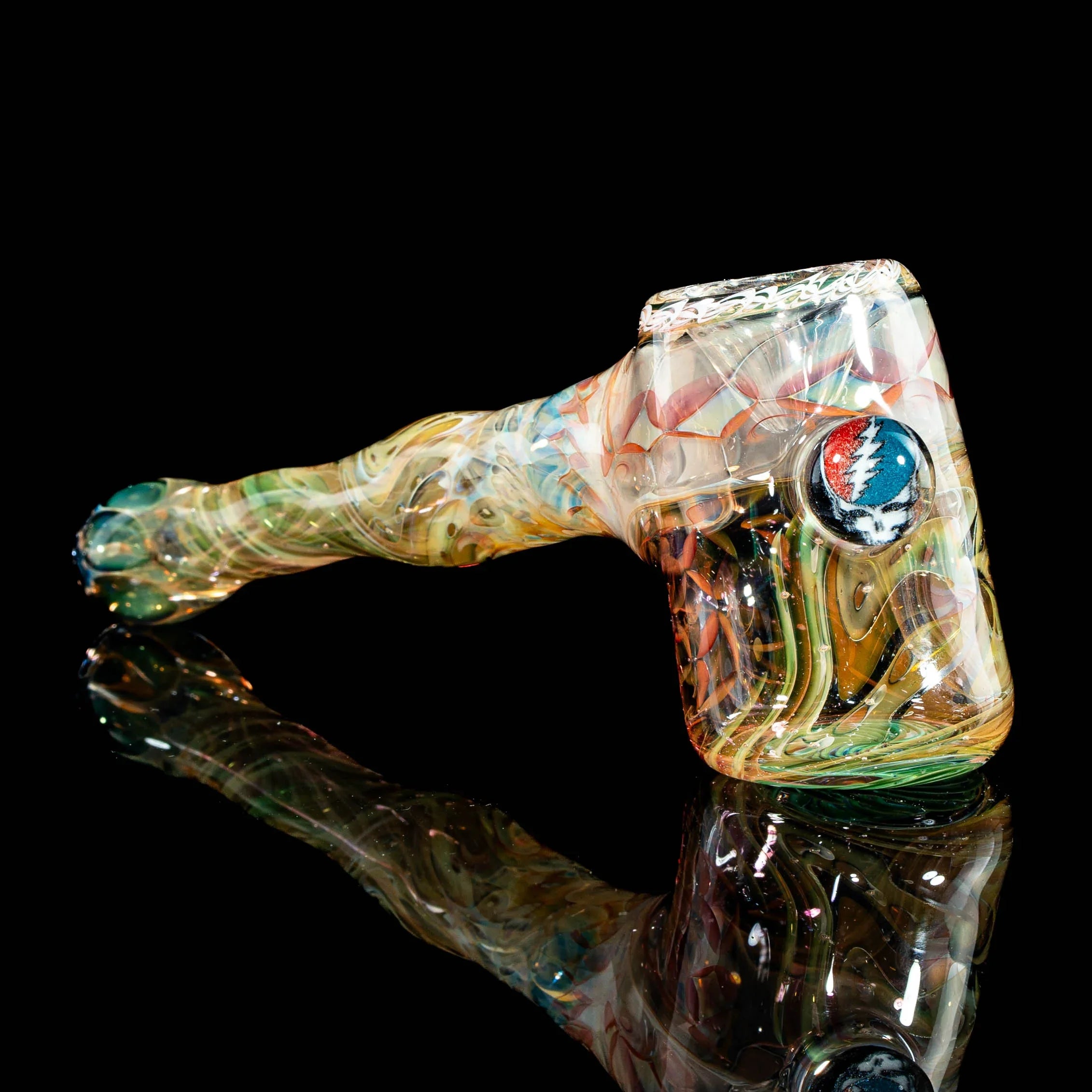 Heady glass hammer pipe with colorful swirl patterns and emblem on black background