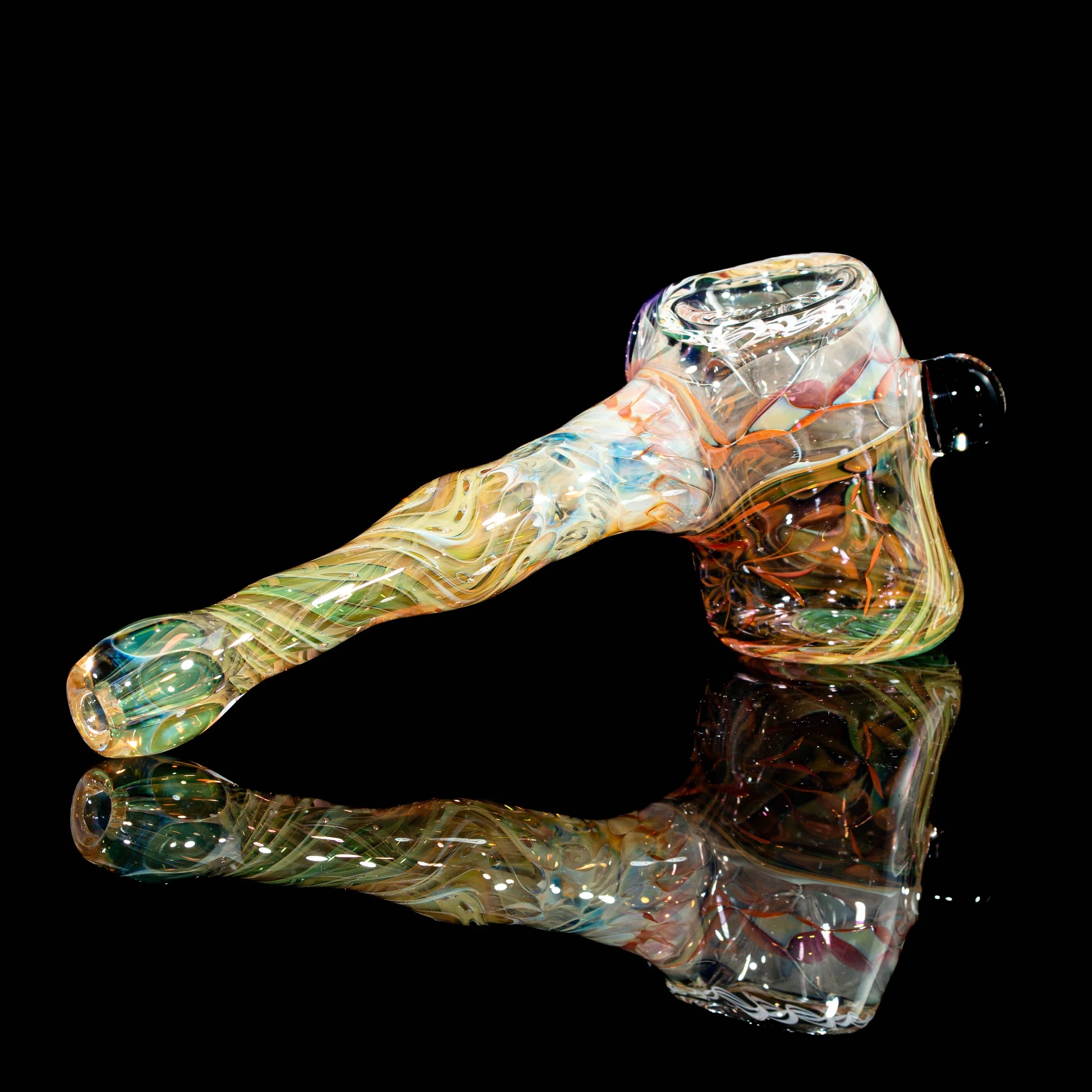 Hand-blown artistic glass pipe with colorful swirled patterns on a black background