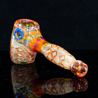 Colorful art glass hand pipe with textured pattern and blue accent on a black background.