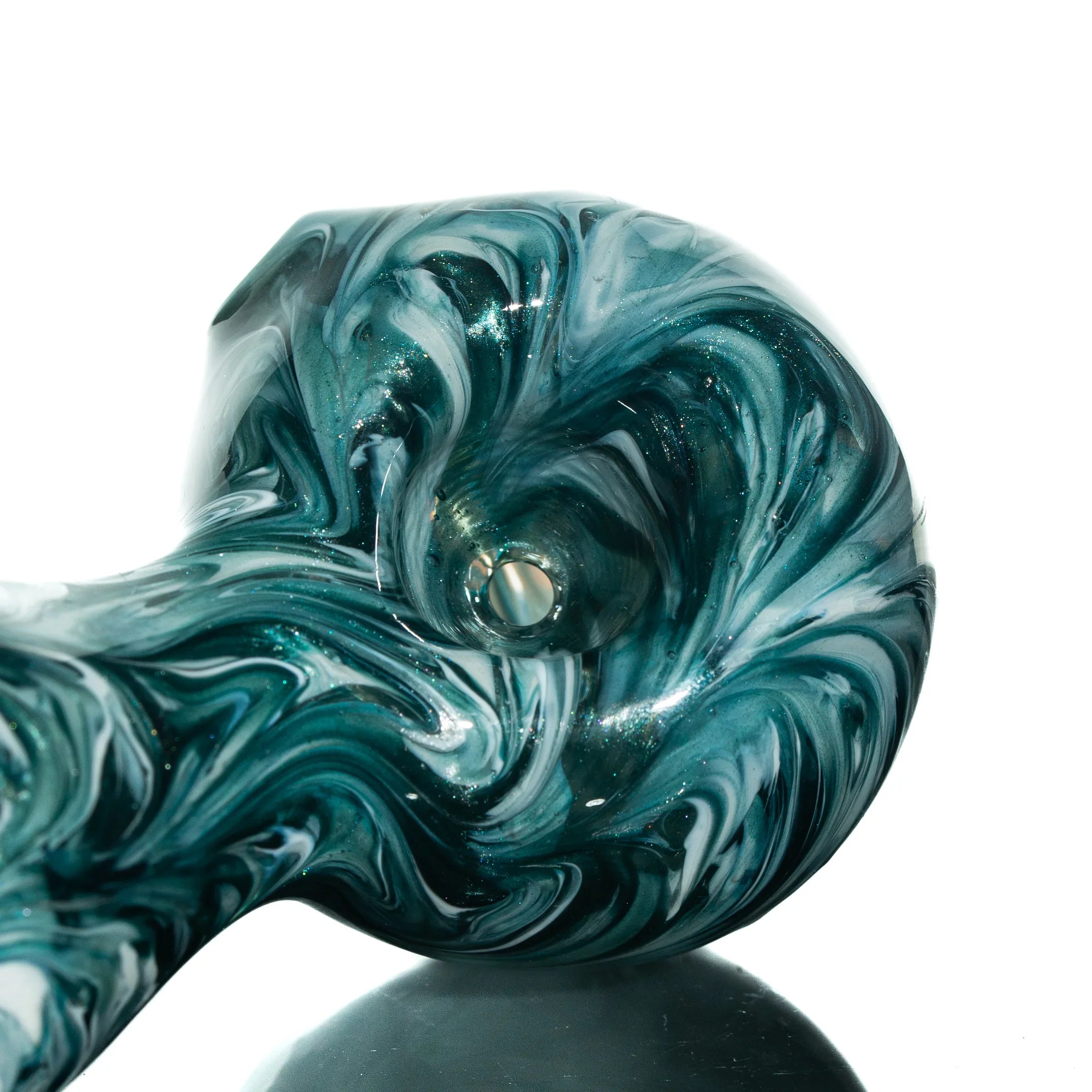 Blue and white glass hand pipe with swirling stardust pattern on a white background