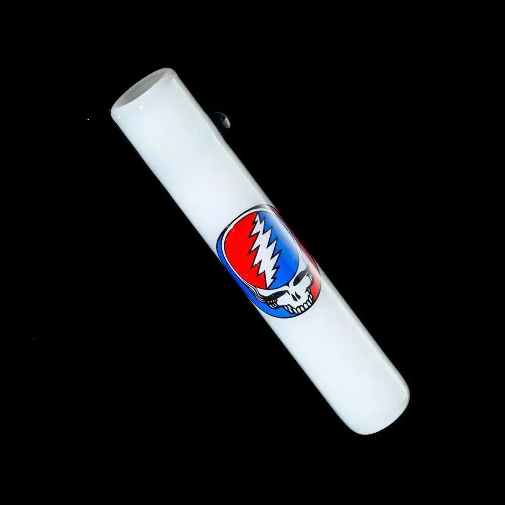 White glass chillum featuring a colorful lightning skull design on black background