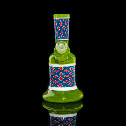 Green glass mini water pipe with blue and red arrow pattern, displayed on black background.