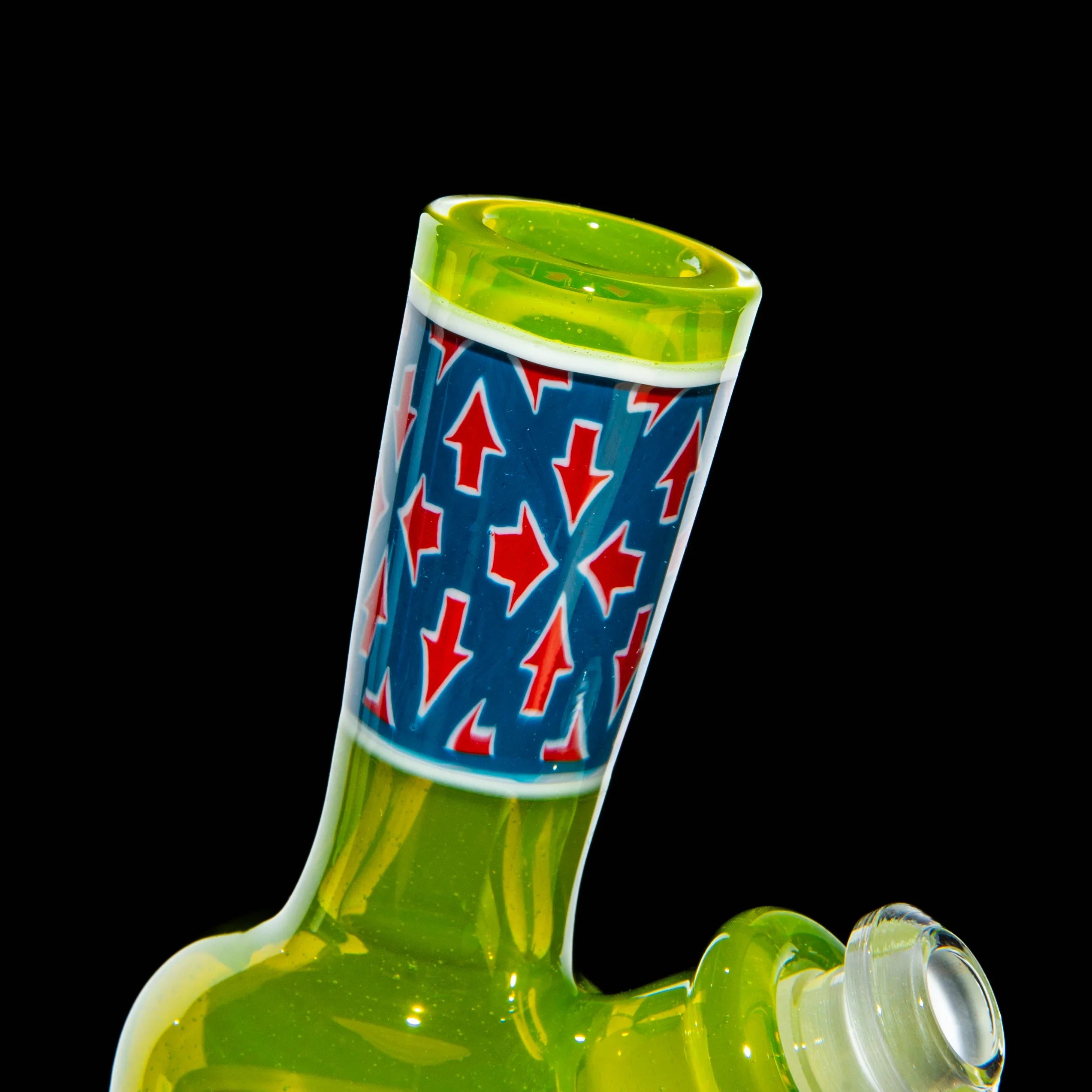 Green glass mini water pipe with blue and red arrow pattern neck on black background
