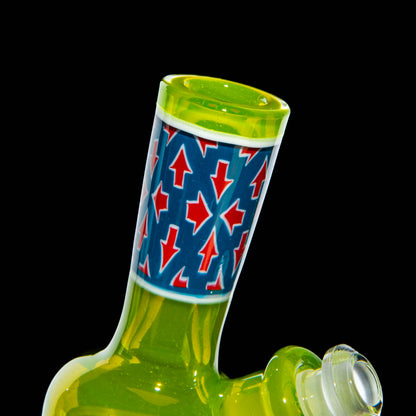 Green glass mini water pipe with blue and red arrow pattern neck on black background