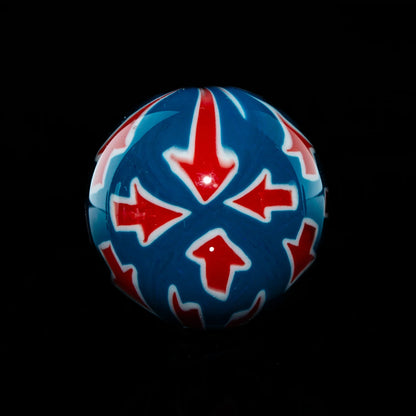 Colorful glass marble with red arrows and blue background for smoking accessories