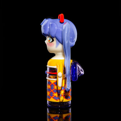Colorful glass art piece shaped like an anime-style character with blue hair, on black background