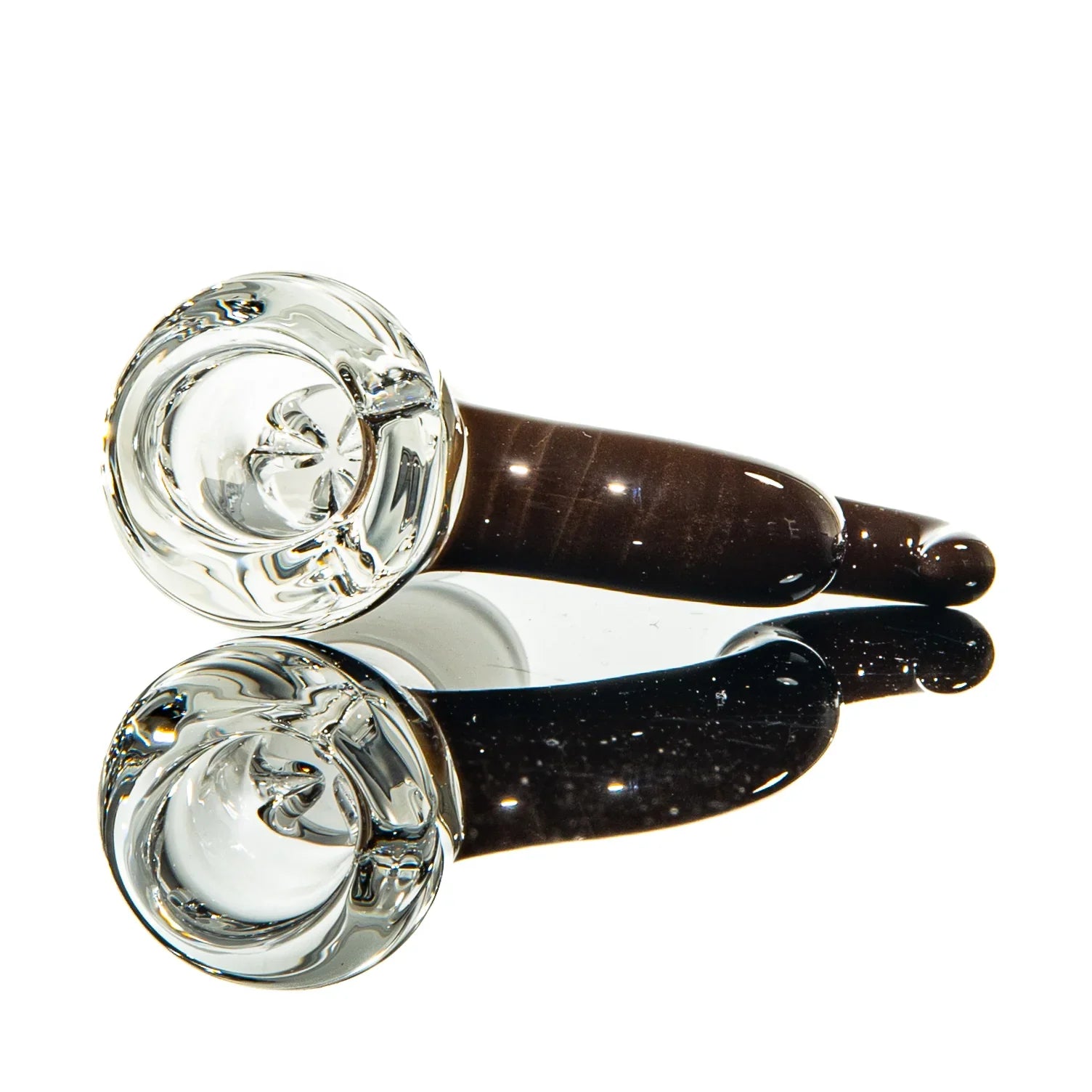 Clear and brown glass one-hitter pipe with a reflected base, showcased on white background.
