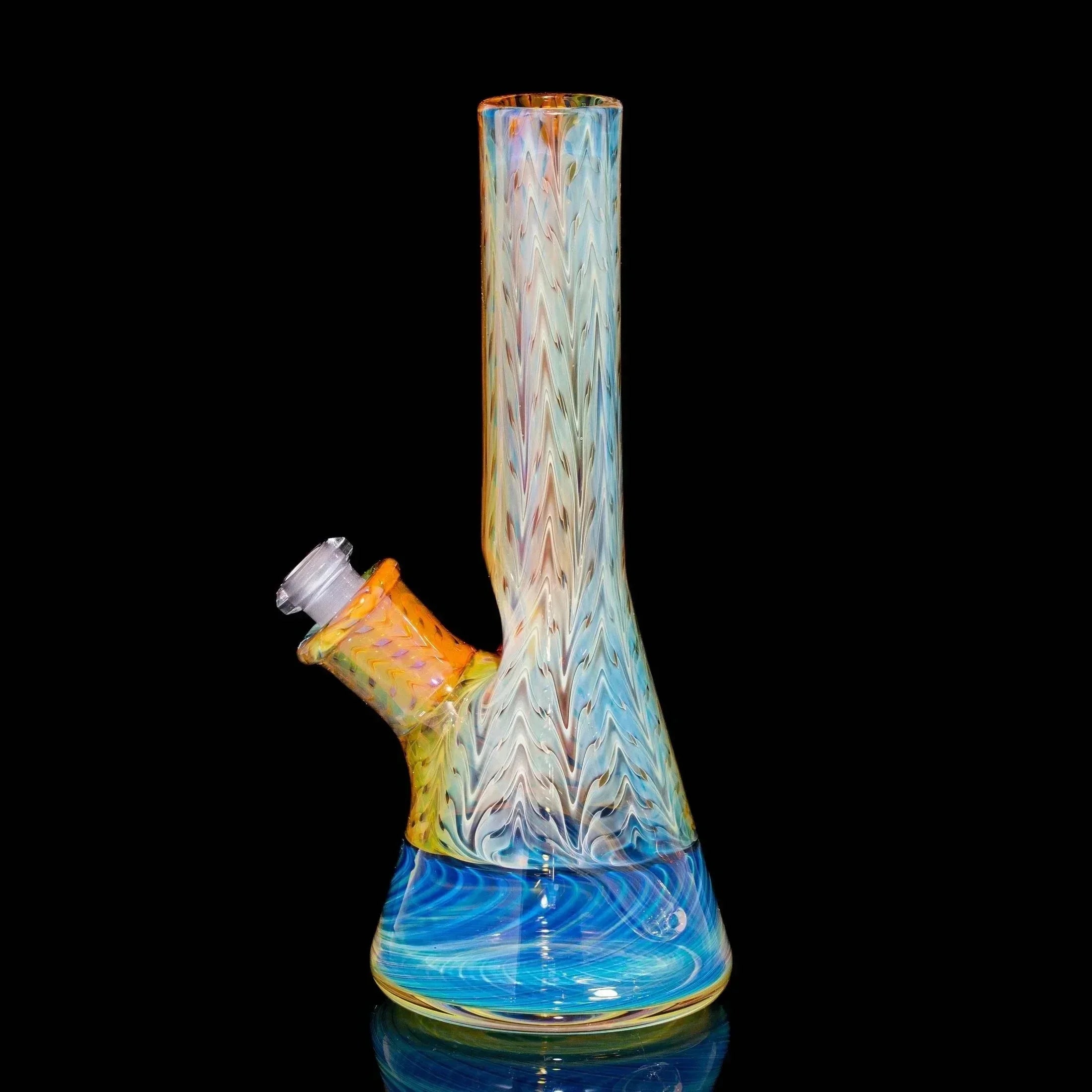 Colorful glass water pipe with blue spiral design on black background