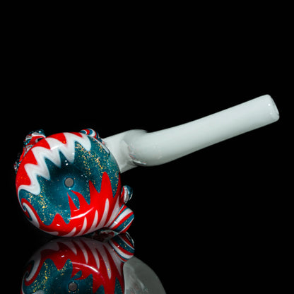 Colorful glass hand pipe with red, white, and teal swirl design on black background