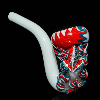 Colorful glass pipe with red, white, and teal swirl accents on a black background