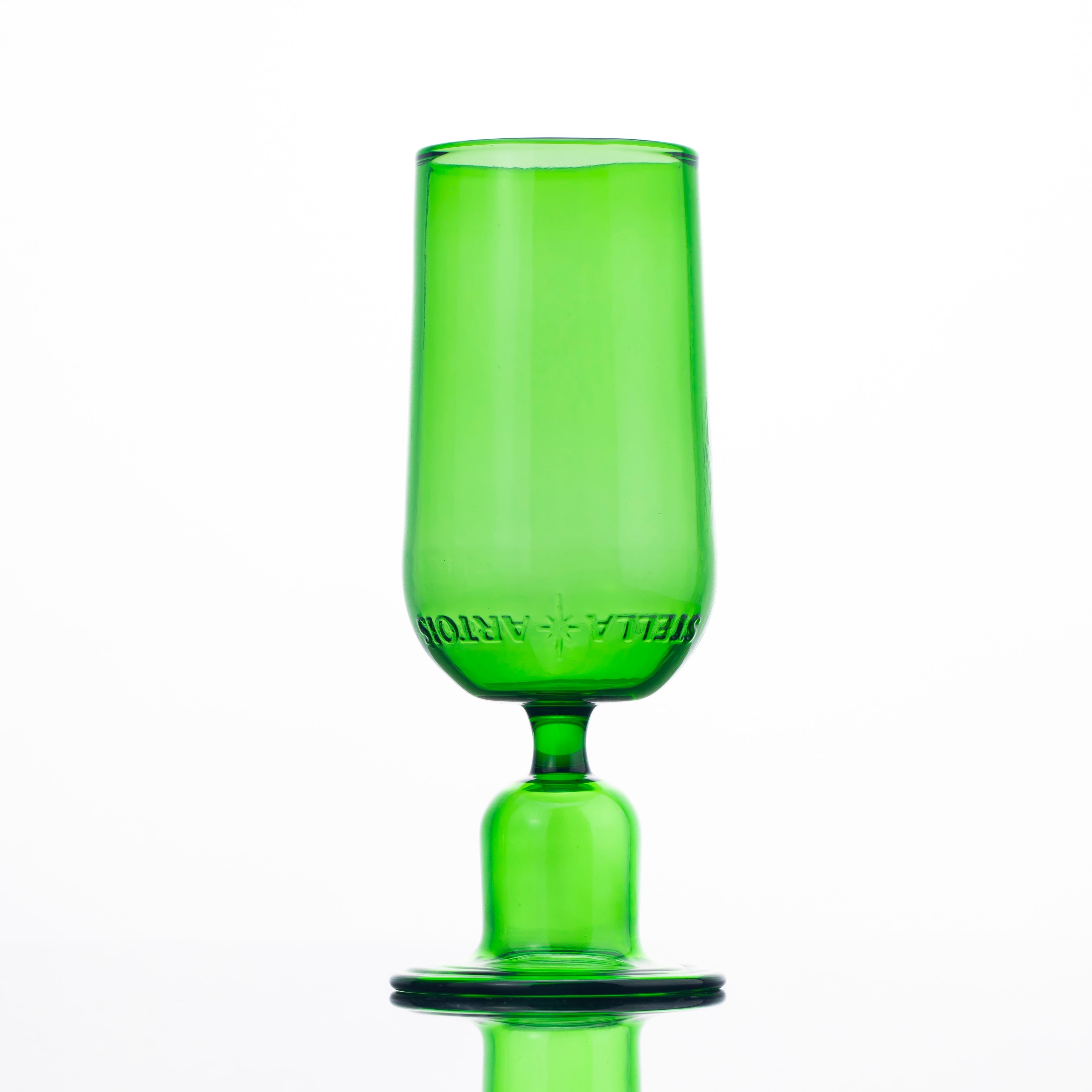 Green glass with a base on a white background