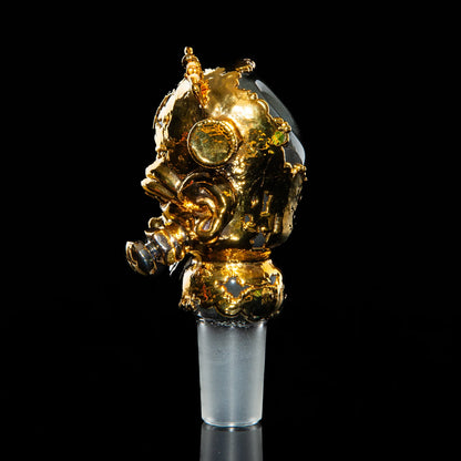 Gold gas mask themed 18mm glass slide with intricate details on black background