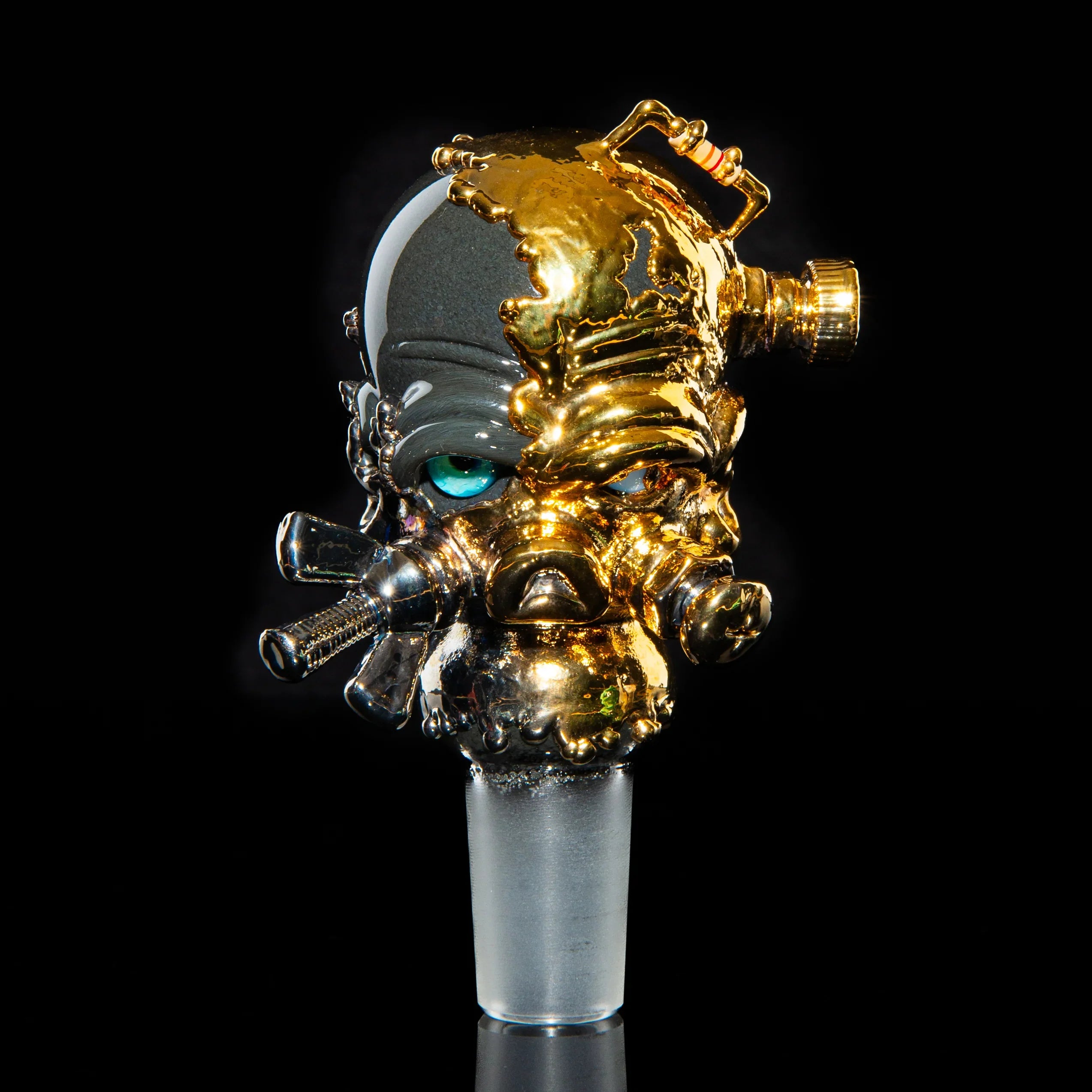 18mm artisan glass slide featuring a detailed gas mask design with metallic gold accents