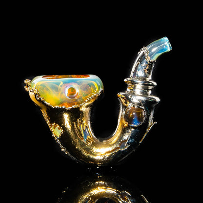 Handcrafted gold and opalescent glass Sherlock pipe with intricate details on black background