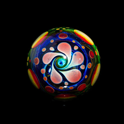 Heady glass marble with colorful swirling patterns and intricate dot accents on black background.