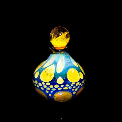 Heady glass jar with blue and yellow accents and a decorative marble lid