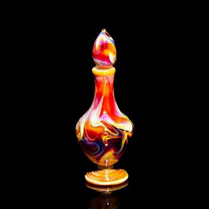 Hand-blown multicolor glass art bottle with swirl patterns on black background
