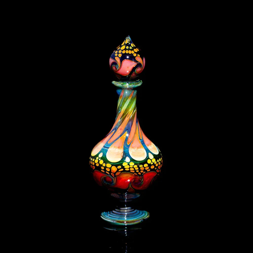 Heady glass art bottle with vibrant swirl patterns and intricate dot accents on black background.