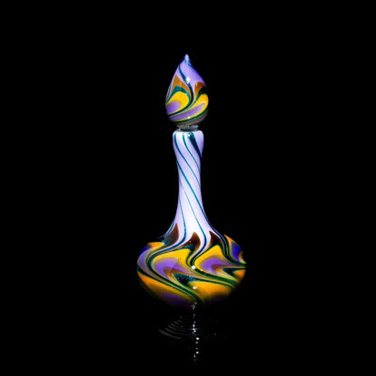 Colorful hand-blown glass bottle with swirled patterns on a black background