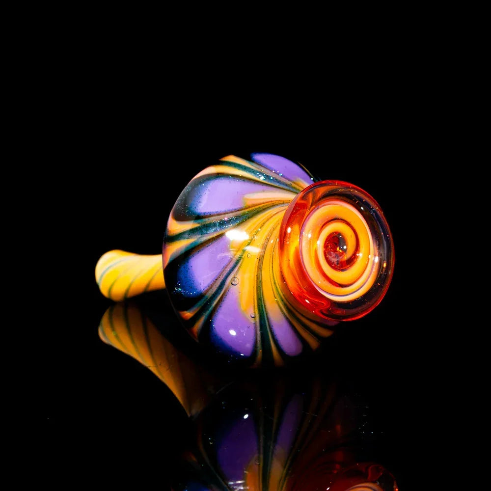 Colorful hand-blown glass pipe with yellow, orange, and purple swirl design on black background