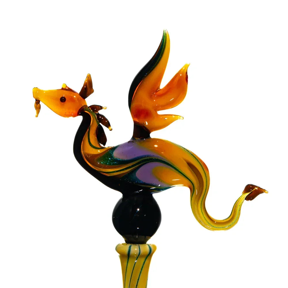 Handcrafted glass dragon pipe with vibrant orange and yellow swirls, artisan smoking accessory