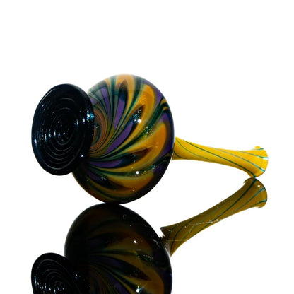 Colorful hand-blown glass pipe with yellow, green, and purple spiral design