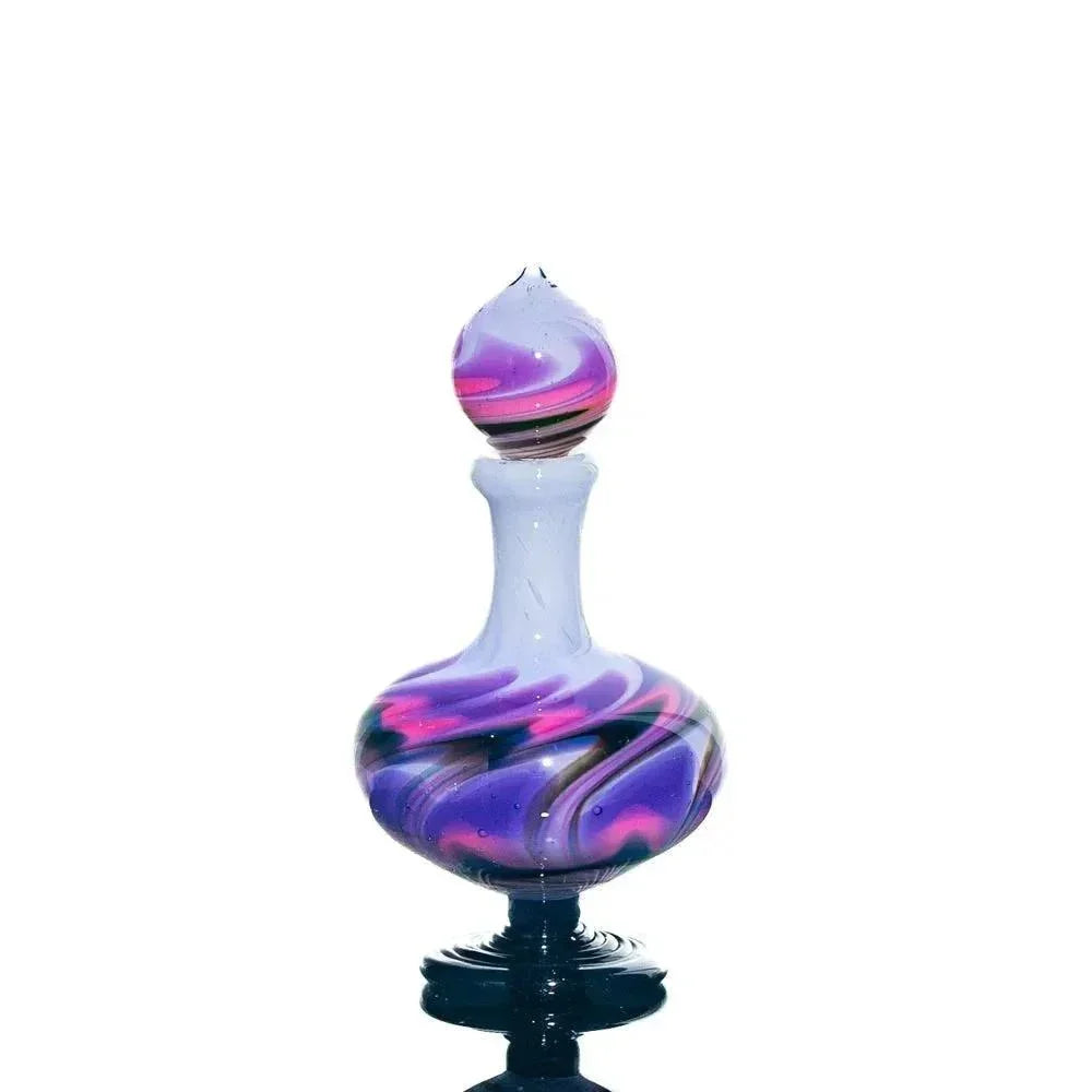 Hand-blown glass perfume jar with purple, pink, and black swirl pattern on white background