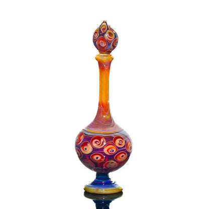 Colorful hand-blown glass perfume jar with swirled patterns and decorative stopper