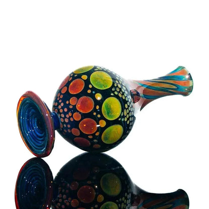 Colorful hand-blown glass jar with vibrant dot patterns and a striped neck