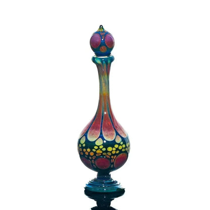 Hand-blown glass perfume jar with colorful, iridescent patterns on a white background.