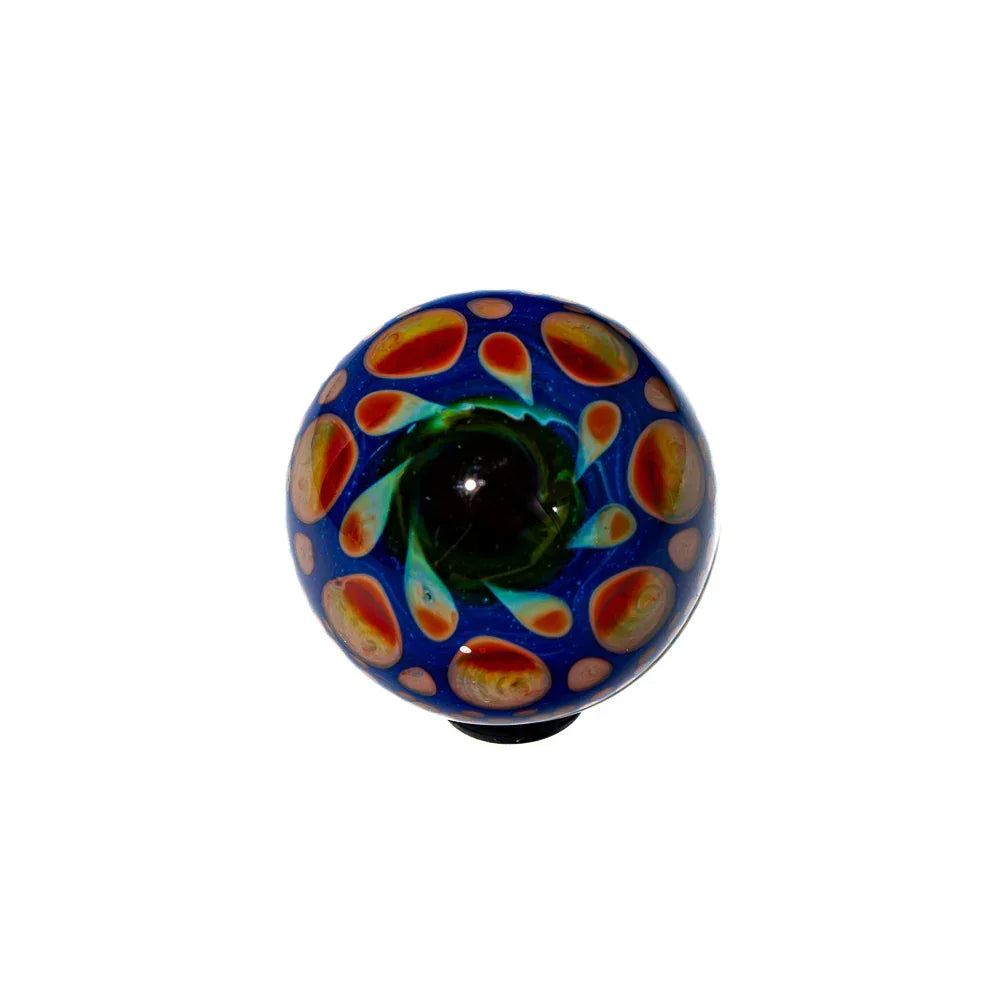 colorful hand-blown glass marble with blue, green, and orange flame-like patterns