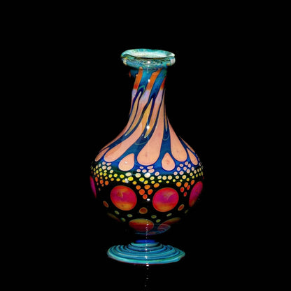 Hand-blown glass marble stand with vibrant sunset colors and dotted hobnail pattern