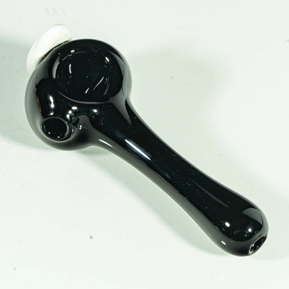 Glossy black glass hand pipe with round bowl and white accent, shown on white background