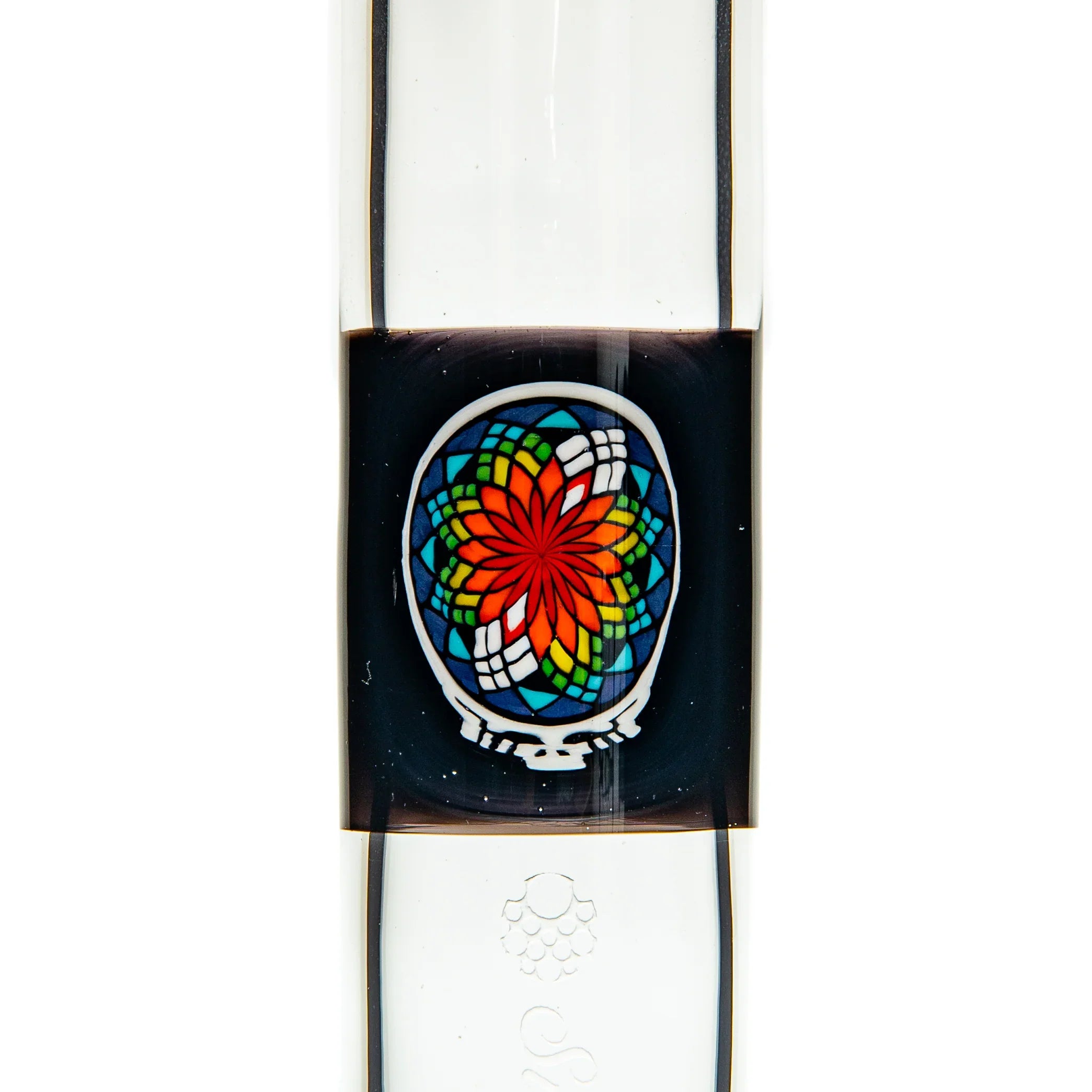 Close-up of a glass water pipe with vibrant stained glass-style flower design