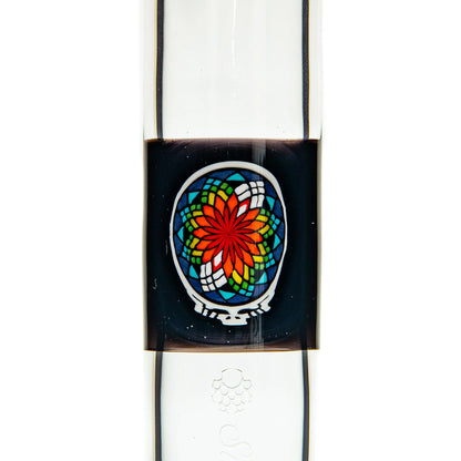 Close-up of a glass water pipe with vibrant stained glass-style flower design
