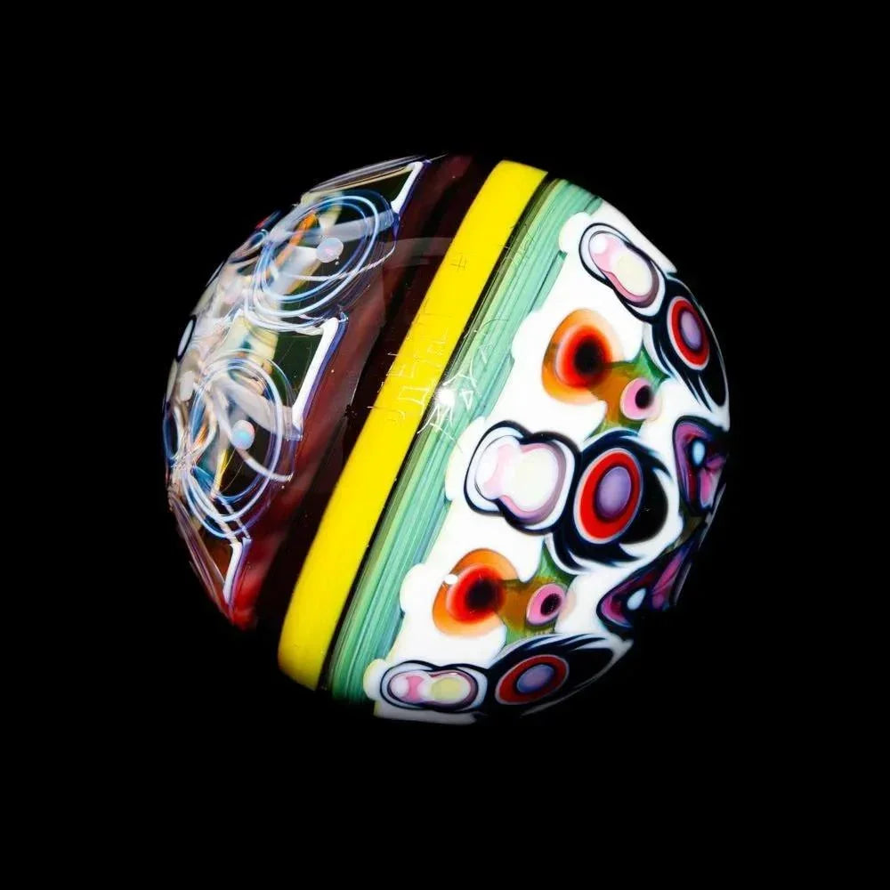 Handcrafted marble with vibrant floral and geometric glass patterns on a black background