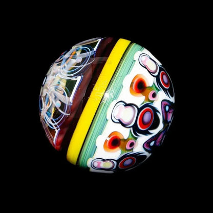 Handcrafted marble with vibrant floral and geometric glass patterns on a black background