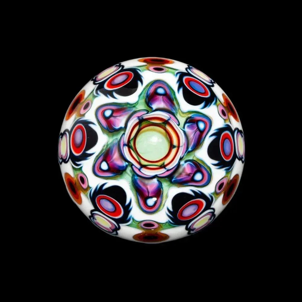 Opal marble glass art with vibrant, intricate psychedelic patterns on a black background
