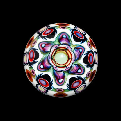 Opal marble glass art with vibrant, intricate psychedelic patterns on a black background