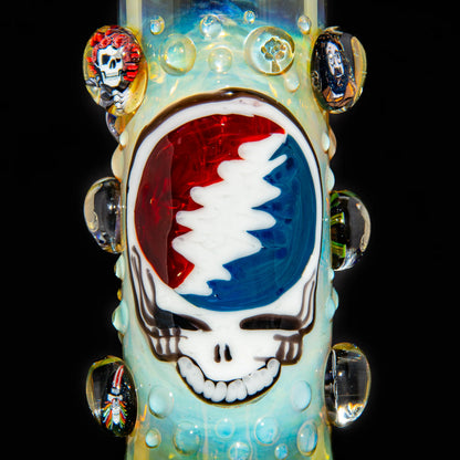 Detailed glass bong featuring a colorful skull and lightning bolt design with clear glass accents.