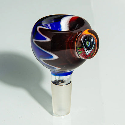 Colorful glass bong bowl slide with blue, red, and white swirls and a decorative marble