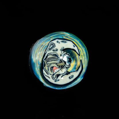 Heady glass marble with swirling colors and detailed moon face design on black background