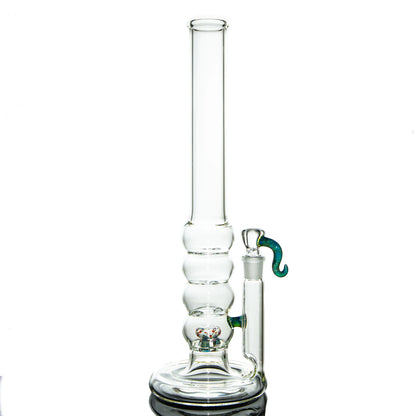Clear glass water pipe with bubble chamber and decorative green handle on white background