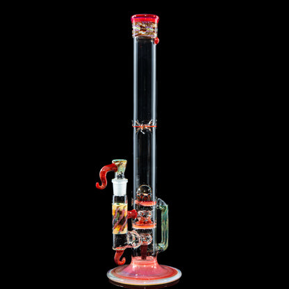 Heady glass water pipe with red and multicolor accents on a black background