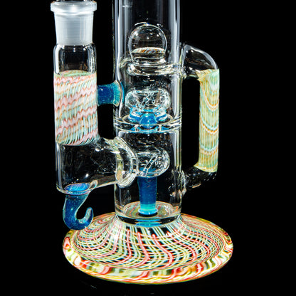Colorful glass water pipe with intricate swirls and handle, displayed against black background.
