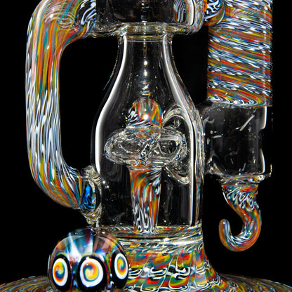 Intricate heady glass water pipe with vibrant rainbow swirls and marble accents on black background