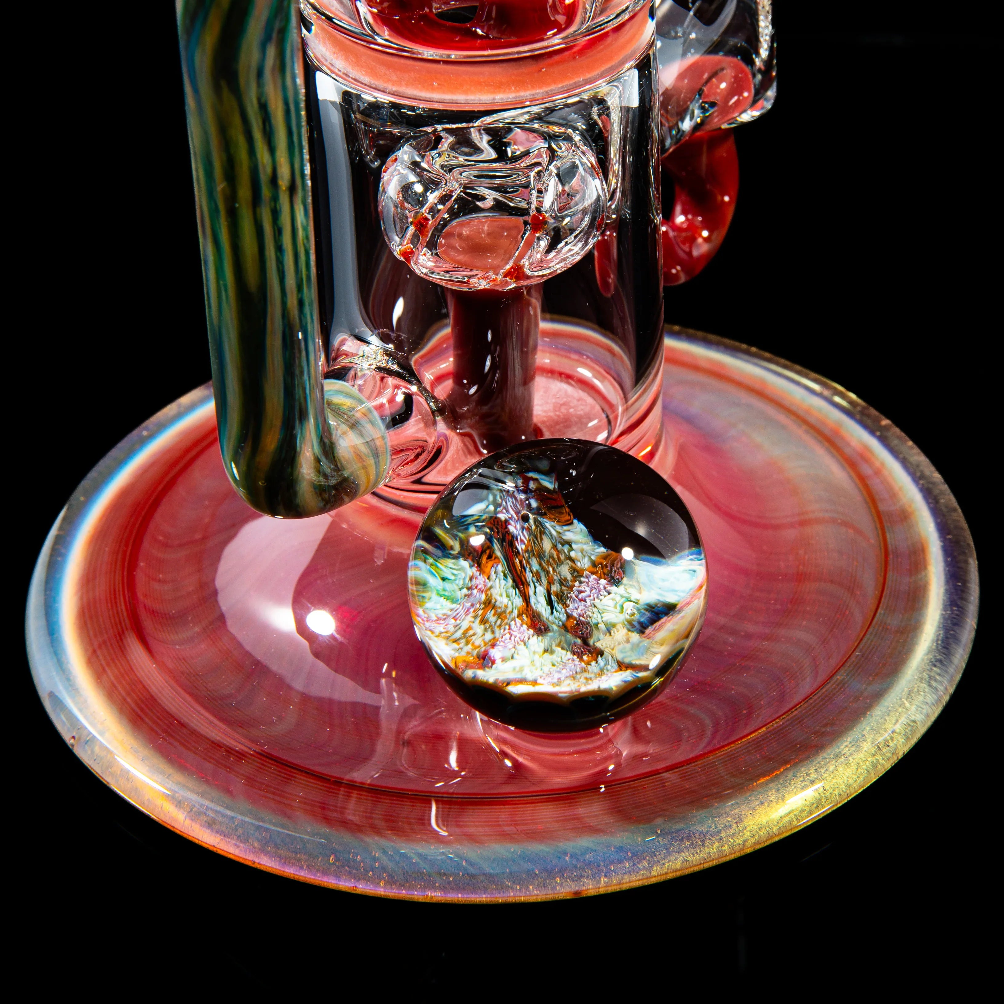 Colorful glass rig with detailed marble accent on iridescent glass base