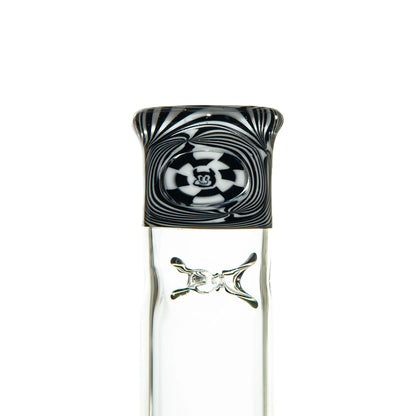 Heady glass bong with black and white swirl pattern, clear body, and skull crossbones detail.