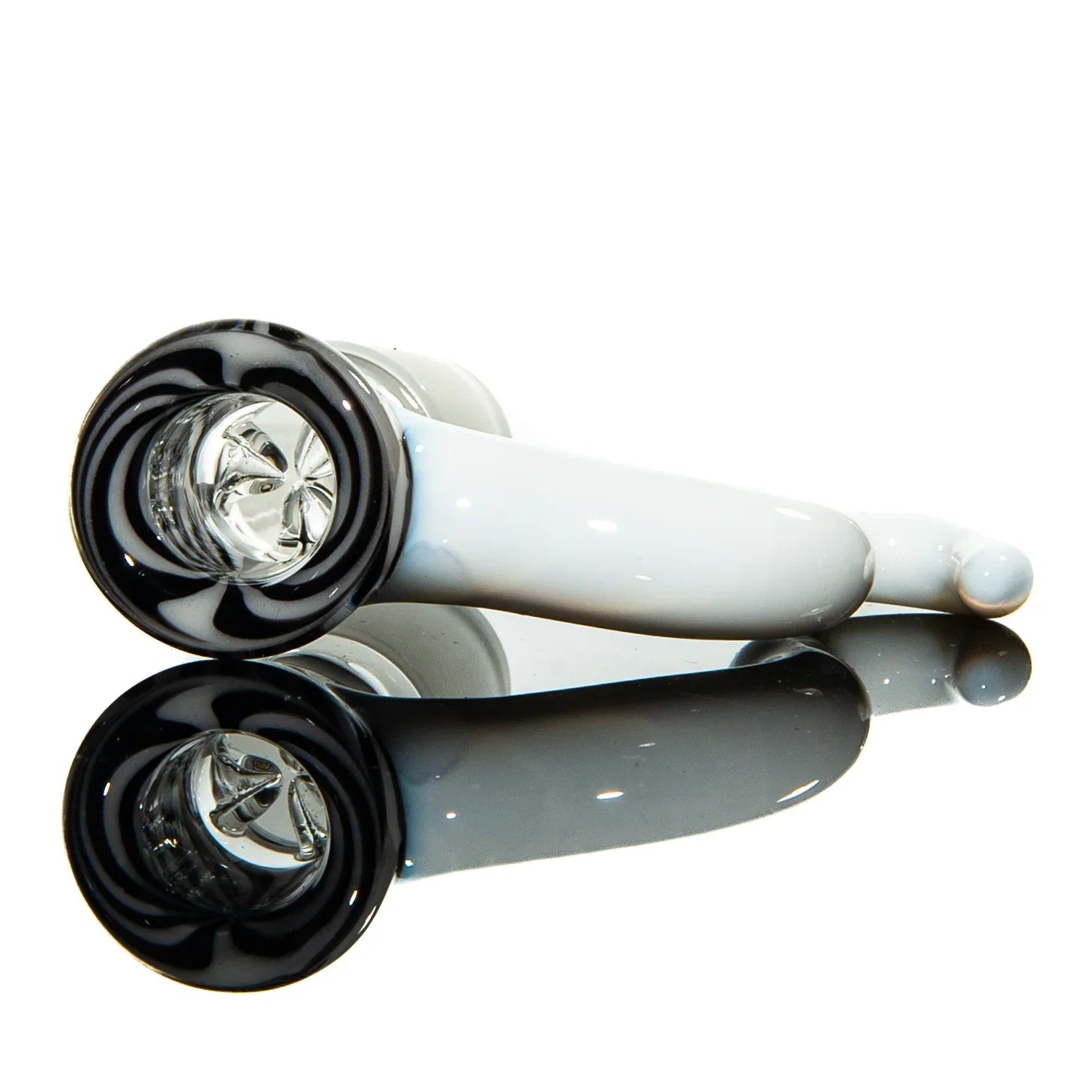 White and black glass hand pipe with spiral design, reflected on a glossy surface