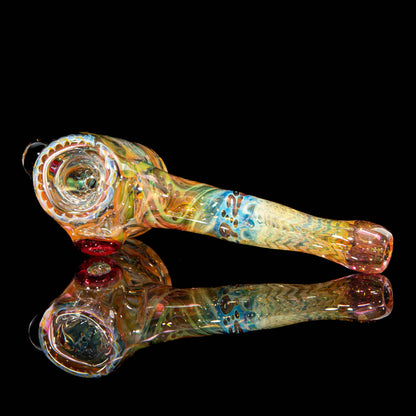 Handcrafted heady glass pipe with vibrant colors and intricate swirling patterns on black background